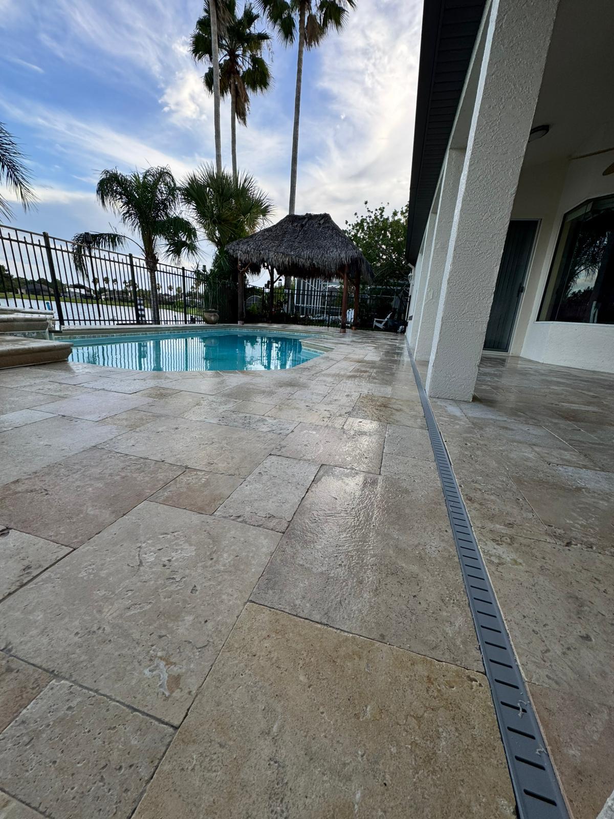 Travertine pool deck with palms